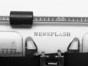 Typewriter typing the word "newsflash"